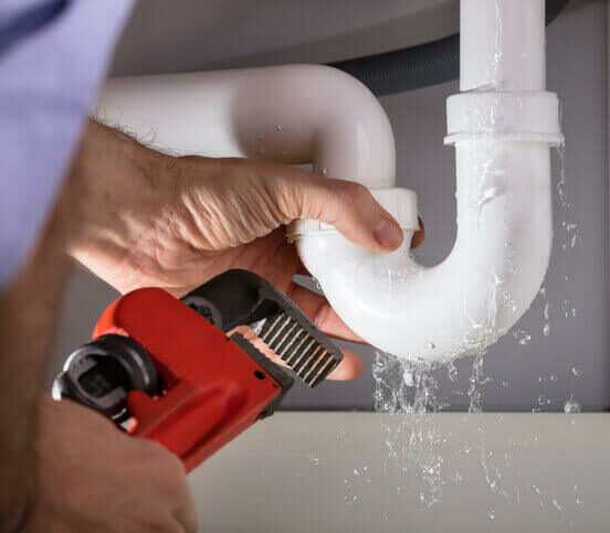 fixing sink pipe with wrench